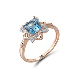 Жіноча золота каблучка з діамантами і топазом