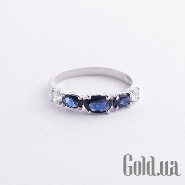 

Женские кольца Украина, Женское серебряное кольцо с куб. циркониями и синт. сапфирами