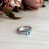 Женское серебряное кольцо с синт. аквамарином и куб. циркониями - фото 2