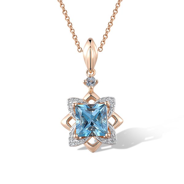 Золотий кулон з діамантами та топазами